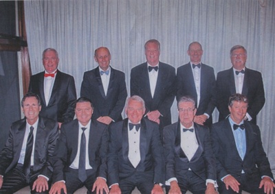 Photograph - A4 colour printed image of group of posed men in suits and bow ties. Context unknown. ; P0231 Photograph - A4 colour printed image of group of posed men in suits and bow ties. Context unknown. ; P0231