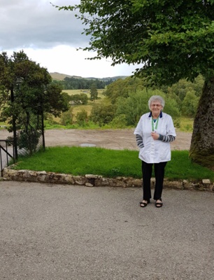 Photograph, Wilma McBain outside the Grouse Inn, Cabrach; 2000s; CT.2024.02.12