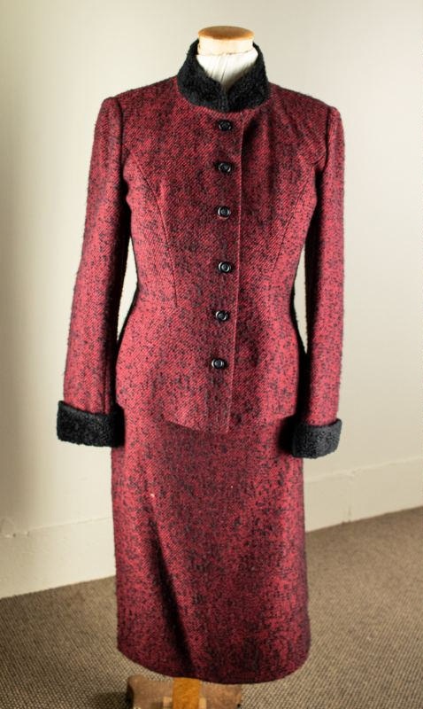 Classic red tweed suit with black fleck, fitted jacket buttoned to neck ...