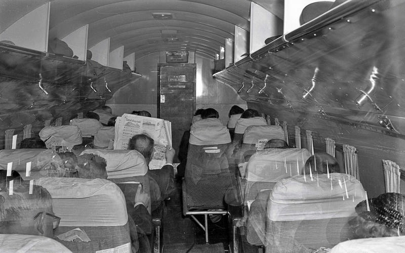 Aviation. Douglas DC3 Aircraft Interior. With Passengers, One with a Newspaper.