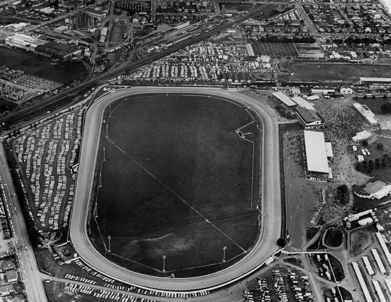 Aerial. Addington Raceway. Large Crowd Arriving for Race Meeting. Harness Racing for Horses. Trotting. the Agricultural And Pastoral Showgrounds are just above. Christchurch, Canterbury, New Zealand.