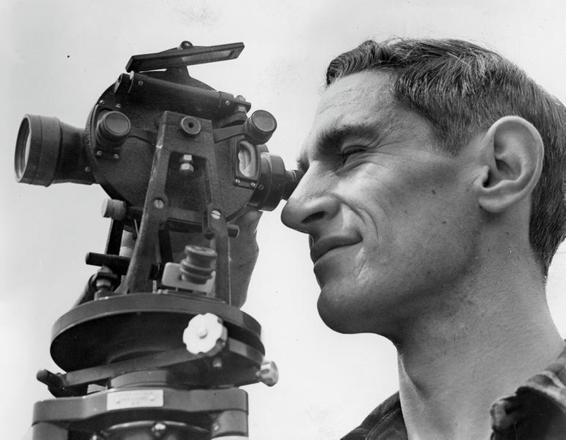 Man with a Theodolite. Surveying. Christchiurch, Canterbury, New Zealand.