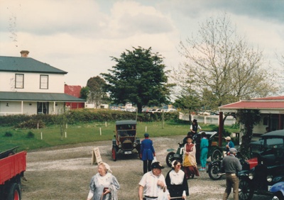 Vintage cars and other vehicles in front of Brindle Cottage at Howick Historical Village on a Live Day.; Ashby, Muriel; P2021.108.24