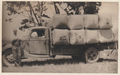 Robert Hattaway Snr and truck loaded with bales of wool.; Hattaway, Robert; 1/12/1945; 2017.581.34