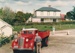 A vintage truck (OC4815) at Howick Historical Village on a Live Day. Bell House is i the background.; Ashby, Muriel; P2021.108.20