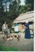 Richard Lees, Lois Abram and Barbara Doughty with the chickens outside the sod cottage.; La Roche, Alan; 2002; 2019.112.03