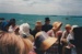 The November 1977 re-enactment of the Fencible and early settler landing at Cockle Bay. Photograph shows new settlers on shore and others approaching in a boat.; November 1977; P2021.92.04