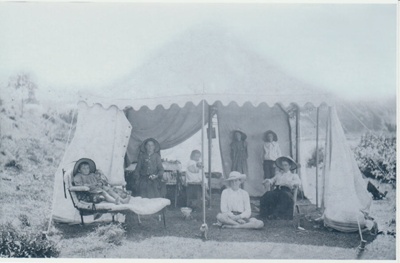 Children and their mothers in a tent behind All Saints Church. cemetery.; c1900; 2018.218.82