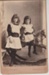 Two unnamed girls. one sitting on a rocking horse.; Hemus, C, Auckland; 2018.363.10
