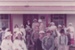 A school group with guides, all in costume, outside Brindle Cottage in Howick Historical Village.; 1982; P2021.181.04
