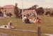 The White family having a picnic lunch on the Green during the opening of White's Store, 20.2.1983.; La Roche, Alan; 20 February 1983; P2020.74.12