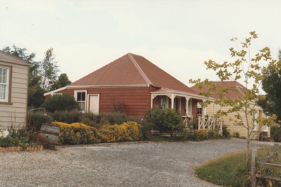 Colonel de Quincey's Cottage on Grey Street at Howick Historical Village, with part of Eckfords' to the left and Johnson"s on the right.; Ashby, J; P2020.108.01