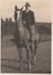 W F Burgess (Bill) on his horse at Bucklands Beach.; D G Begg Ltd., Fort Street, Auckland; 2017.448.33