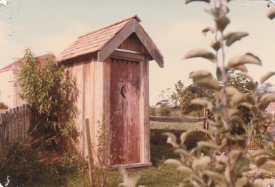 The outhouse once belonging to Jean Batten's family, now at Howick Historical Village. ; La Roche, Alan; September 1984; P2021.89.03
