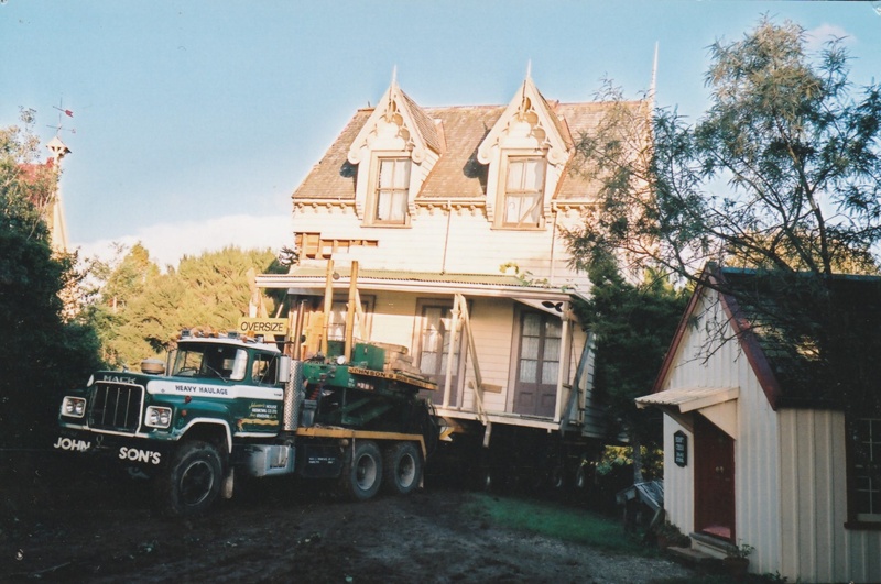 Johnson's truck moving Puhinui past the Dame School on its way to its new site in the Howick Historical Village.