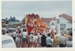 The crowd watching girls wearing a feathered costume on a float in the Howick Santa Parade, 30th November 1960.; Young, Heather; 30 November 1960; P2022.06.12