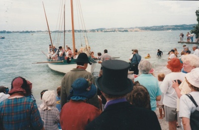 The November 1977 re-enactment of the Fencible and early settler landing at Cockle Bay. Photograph shows the settlers being rowed ashore.; November 1977; P2021.92.05