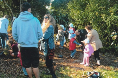 50th anniversary celebration of the Howick and Districts Historical Society. Children are planting Kanuka trees behind Pakuranga School.; La Roche, Alan; 20 May 2012; P2022.27.03