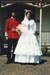 Matthew Bonnet (65th regiment) and Rowan Southern as bride and groom in their costumes for the fashion parade at Puhinui on an HHV Live Day. ; Palmer, Ros; October 2003; 2019.198.25