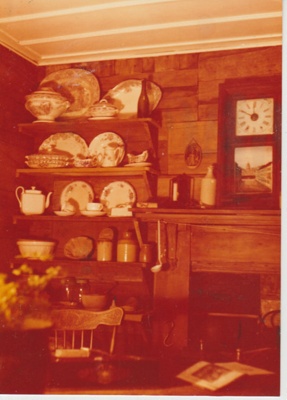 The interior of Sergeant Barry's cottage in the Garden of Memories.; La Roche, Alan; 1/08/1978; 2019.097.02