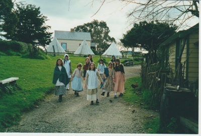 Girls in costume, walking down Church Street at the Howick Historical Village; La Roche, Alan; 2019.102.02