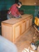 David Wardlaw working on a kitchen cabinet in Puhinui. ; Alan La Roche; 2003; P2020.14.30
