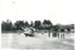 Captain Fred Ladd's amphibian plane on Howick Beach; Wilson, W T; 1950s; 2016.538.43