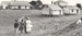 People on the grass looking at the rear of the cottages on Church Street, the Parsonage and Bell House.; Eastern Courier; 1979; P2022.24.13
