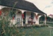 Christmas, past and present at Howick Historical Village, 12 December 1987.  Looking towards Sergeant Barry's cottage.; Ashby, Frank; 12 December 1987; P2021.190.41