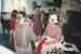 Brenda Scott, in costume, with children in White's Store; P2021.105.11