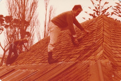 David Edwards and helper on the roof of Eckford's homestead before removal to the Howick Historical Village. ; La Roche, Alan; 13 May 1978; P2021.09.11