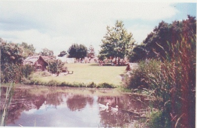 Looking across the pond at the Howick Historical Village; 1990; 2019.122.02