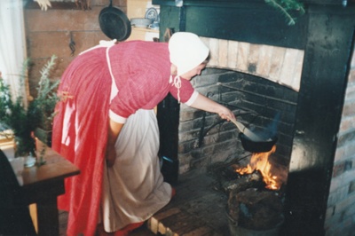 Ros Palmer cooking on an open fire on a Live Day, HHV.  ; 22 August 2006; 2019.196.11