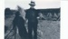 Ned Fitzpatrick harvesting at Pakuranga showing rye stacks.; 1928; 2018.340.01