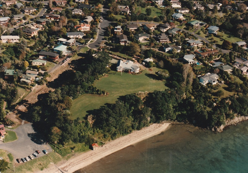 Aerial photo of Mellons Bay, showing houses, the beach and the track up