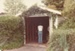 A man standing inside an Epsom garage which was to be demolished and re-built at the Vicarage at the Historical Village for the tenant's car. ; La Roche, Alan; November 1982; P2020.33.01
