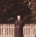 Rev. Robert Hattaway in front of a picket fence, probably at Hawthorn Farm.; 1988; P2021.162.05