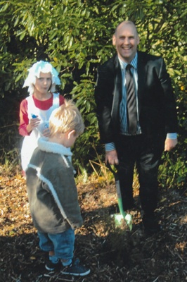 50th anniversary celebration of the Howick and Districts Historical Society. Michael Wilson is planting a tree with his children.; La Roche, Alan; 20 May 2012; P2022.27.04