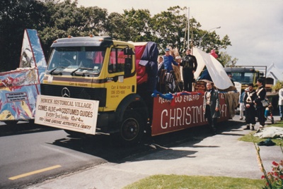 Members of the Historical Society on a float in the Christmas Parade.   1995. ; 1995; P2021.199.01