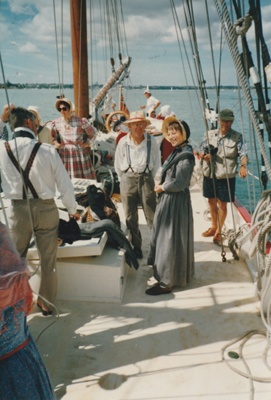 The November 1977 150th re-enactment of the Fencible and early settler landing at Cockle Bay. Photograph shows the settlers, Marin Burgess (in front of mast) Alan la Roche and Barbara Doughty (Centre).; November 1977; P2021.92.06