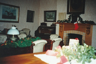 Puhinui living room decorated for Christmas at Howick Historical Village, December 2000.; La Roche, Alan; 2 December 2000; P2022.05.04