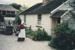Margaret Robinson, in costume outside Briody-McDaniel cottage in Howick Historical Village. ; c2000; P2021.105.46