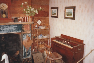 The living area of Briody-McDaniels Cottage at Howick Historical Village.

; 1997; P2020.102.01
