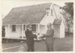 Alan la Roche receiving a donation of $1500.00 for the restoration of Sergeant Barry's Cottage in the Garden of Memories, from Fred Barber, the Finance Chairman of the Howick Borough Council.; August 1995; P2021.110.01
