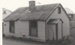 Maher-Gallagher Cottage, formerly Carter Cottage, in position at the Howick Historical Village.; Eastern Courier; September 1980; P2020.95.06