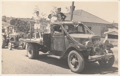 The Tennis Club Float with Ralph Jordan, Shirley Front, Pat Kontze and Evelyn Brickell on the tray, coming up Selwyn Road during the 1947 Centennial Parade.; Batchelor's Candid Studio; November 1947; P2022.38.13