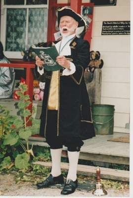 Ron Fryer, as the Town Crier, on the steps of Brindle Cottage.; 2019.132.02