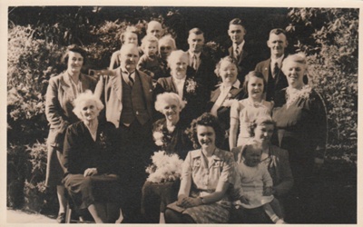 Martha Hattaway, 1852-1915, on her 80th birthday with her sister Fanny and other family members.; Ikonta Studios, Queen St. Auckland; 14 May 1947; p2021.163.09