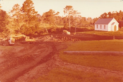 A bulldozer digging out the pond in the Howick Historical Village.; La Roche, Alan; 24 April 1979; P2022.19.04