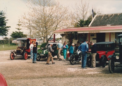 Vintage cars and other vehicles in front of Brindle Cottage at Howick Historical Village on a Live Day.; Ashby, Muriel; P2021.108.22
